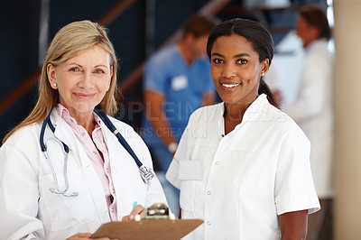 Buy stock photo Doctor, women and teamwork portrait in healthcare with clipboard, health information and smile in hospital. Medical partnership, professional and cardiology career for support, trust and diversity