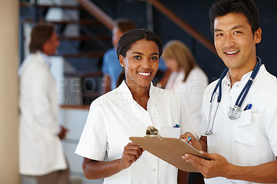 Buy stock photo Doctor, portrait and discussion for report, results and paperwork for health and wellness. Cardiologist, stethoscope and medical chart for healthcare, insurance or professional diagnosis for thinking