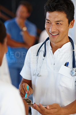 Buy stock photo Asian doctor, communication and discussion with report, results and paperwork for health and wellness. Cardiologist, stethoscope and medical chart for healthcare, insurance and professional diagnosis