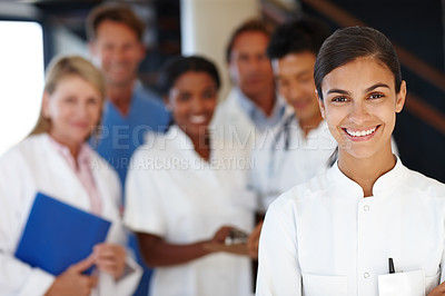Buy stock photo Doctors, group and portrait with woman in hospital for diversity, medicine or colleagues for healthcare. Men, people and happy in team with medical staff for solidarity, pride or leadership in clinic
