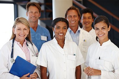 Buy stock photo Doctors, group and portrait with smile in hospital with diversity, medicine and colleagues for healthcare. Men, women and happy in team with medical staff for solidarity, pride and wellness in clinic