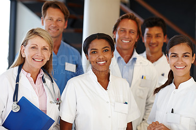 Buy stock photo A shot of a group of medical professionals smiling at the camera