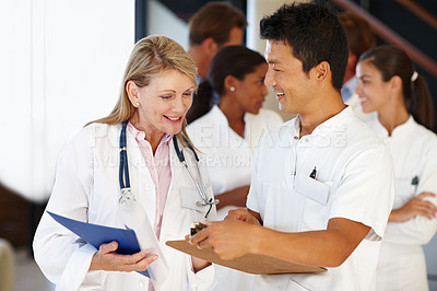 Buy stock photo Doctors, medical and team in hospital with clipboard for results, discussion and health for nurse. Diverse people colleagues or medic for healthcare, expert and medicine for planning and research