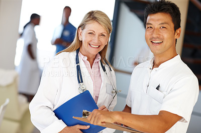 Buy stock photo Doctors, clipboard and smile for medical and team in hospital for results, discussion and health for nurse. Diverse people, colleagues or medic for healthcare, expert and medicine for planning 