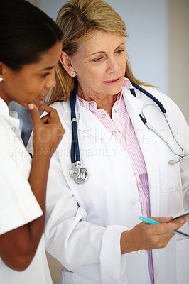 Buy stock photo Doctor, mentor and discussion with report, results and paperwork for health and wellness. Cardiologist, stethoscope and medical chart for healthcare, insurance and professional diagnosis for thinking