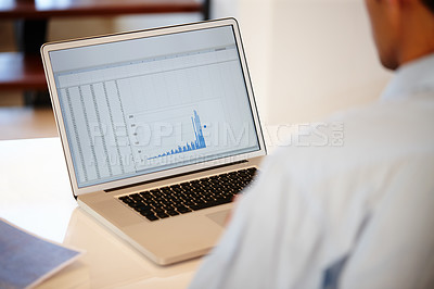 Buy stock photo Cropped shot of a businessman working on his laptop