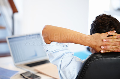 Buy stock photo Rear view of a businessman taking a break from his work assignments