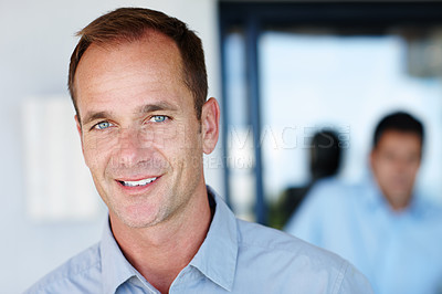 Buy stock photo Shot of a handsome mature man in an office environment