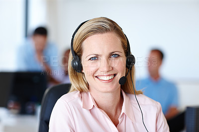 Buy stock photo Shot of a beautiful young woman wearing her headset in the office