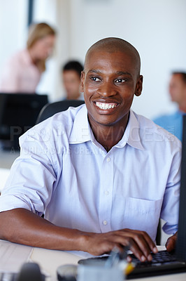 Buy stock photo African businessman, computer and smile in modern office with pride for online career, typing and emails. Black male person, technology and cheerful in workplace for web design start up company