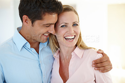 Buy stock photo Couple, embrace and smile together in portrait for love, romance or memories in home. Laughing, man and woman hug in house happy, bonding and sentimental for relationship, affection or support