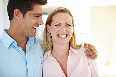 Buy stock photo Couple, hug and smile together in portrait for love, romance or memories in home. Laughing, man and woman embrace in house happy, bonding and sentimental for relationship, affection or support