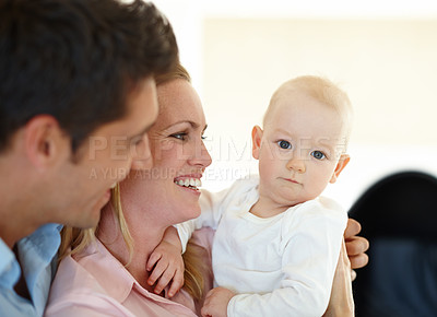 Buy stock photo Mother, father and baby for love embrace in home as childhood development, security or bonding. Man, woman and kid connection together as family or morning hugging with parent joy, comfort or support