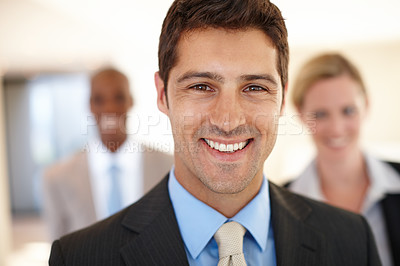 Buy stock photo Smile, colleagues and businessman in corporate portrait, lawyer and team in office. Attorneys, confident partnership in law firm for legal advice, happy people for company meeting for career