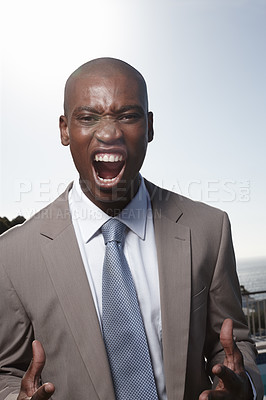 Buy stock photo Business man, city and shouting with anger, stress and mental health in career for justice. African corporate lawyer, attorney or employee with screaming, voice and noise by blue sky with buildings