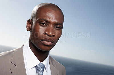 Buy stock photo Business man, serious and portrait by sea, horizon and suit for career, development and growth in summer. African lawyer, attorney or advocate in justice system with sunshine by ocean in New York