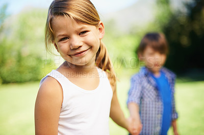 Buy stock photo Portrait, children and smile of girl outdoor for bonding, love and family holding hands together in summer garden. Face, kids and happy siblings, brother and adorable young sister at park in nature