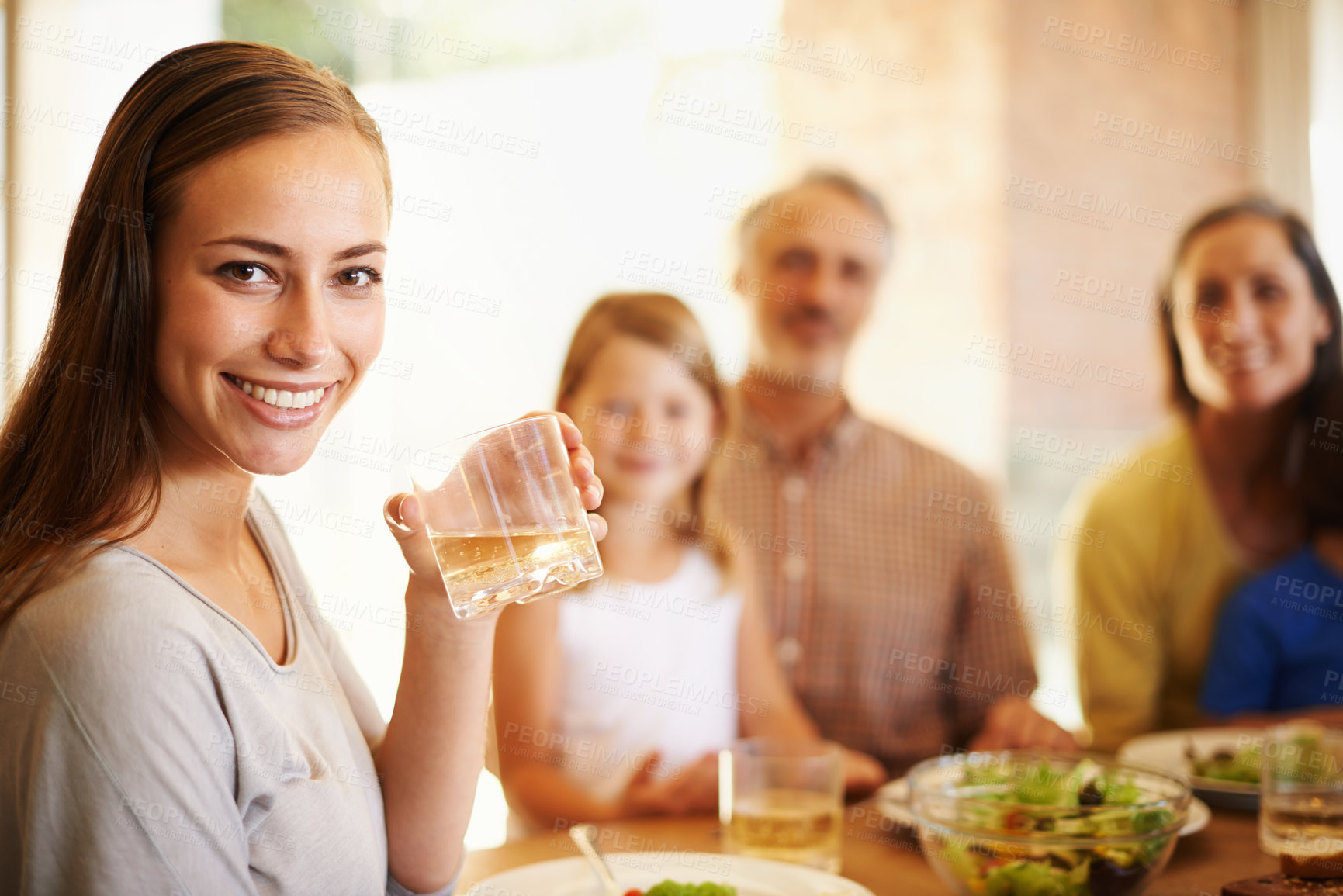 Buy stock photo Portrait, happy woman and family eating lunch in home together for nutrition, health or wellness of child with grandparents. Face, food and smile of mother with drink, salad or meal for diet at table