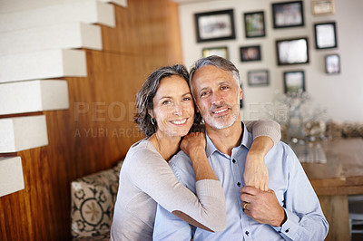 Buy stock photo Love, hug and portrait of mature couple in a house with support, safety and security, care or bonding. Happy, marriage or face of people embrace in living room with solidarity, trust or holding hands