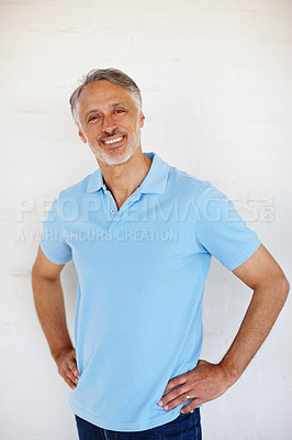 Buy stock photo Portrait, confidence and smile of senior man on brick wall for fashion isolated on a white background in Switzerland. Face, mature and happy person in casual clothes, shirt and positive for style