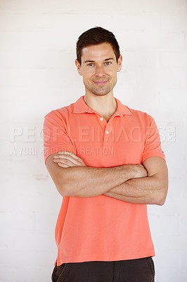 Buy stock photo Man, confident and arms crossed with portrait, trendy and happy with white background in studio. Male person, model and smile with pride, clothes and shirt for edgy style with fashion in Barcelona