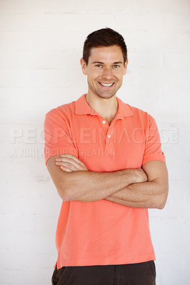 Buy stock photo Studio shot of a young man with his arms crossed