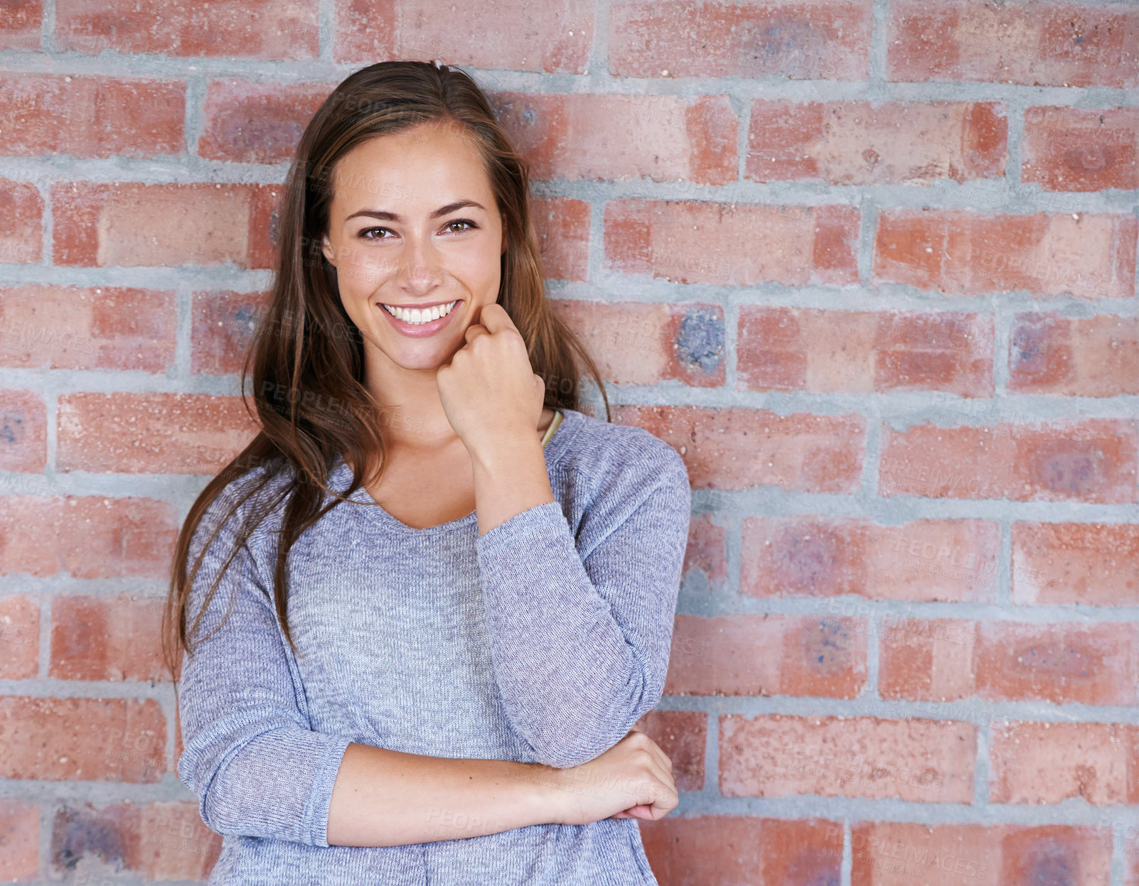 Buy stock photo Brick wall, leaning and portrait of woman with smile for scholarship to university in USA. Background, student and female person with happiness in campus of academy, gen z and girl back to school