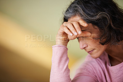 Buy stock photo Home, stress and senior woman with headache, anxiety and retirement with fatigue and tired in a lounge. Old person, pensioner or elderly lady with a migraine or medical problem with crisis or burnout