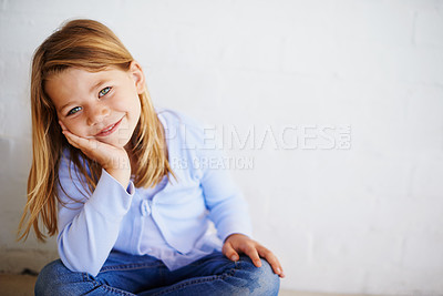 Buy stock photo Children, portrait and girl in house happy, calm or chilling on a floor alone on the weekend again wall background. Child development, youth and face of curious kid relax in at home while daydreaming