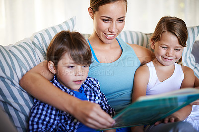 Buy stock photo Mother, children and reading on sofa with book for fantasy story and learning for english literature or language skills for development. Family, relax and happy on couch in home with love and bonding