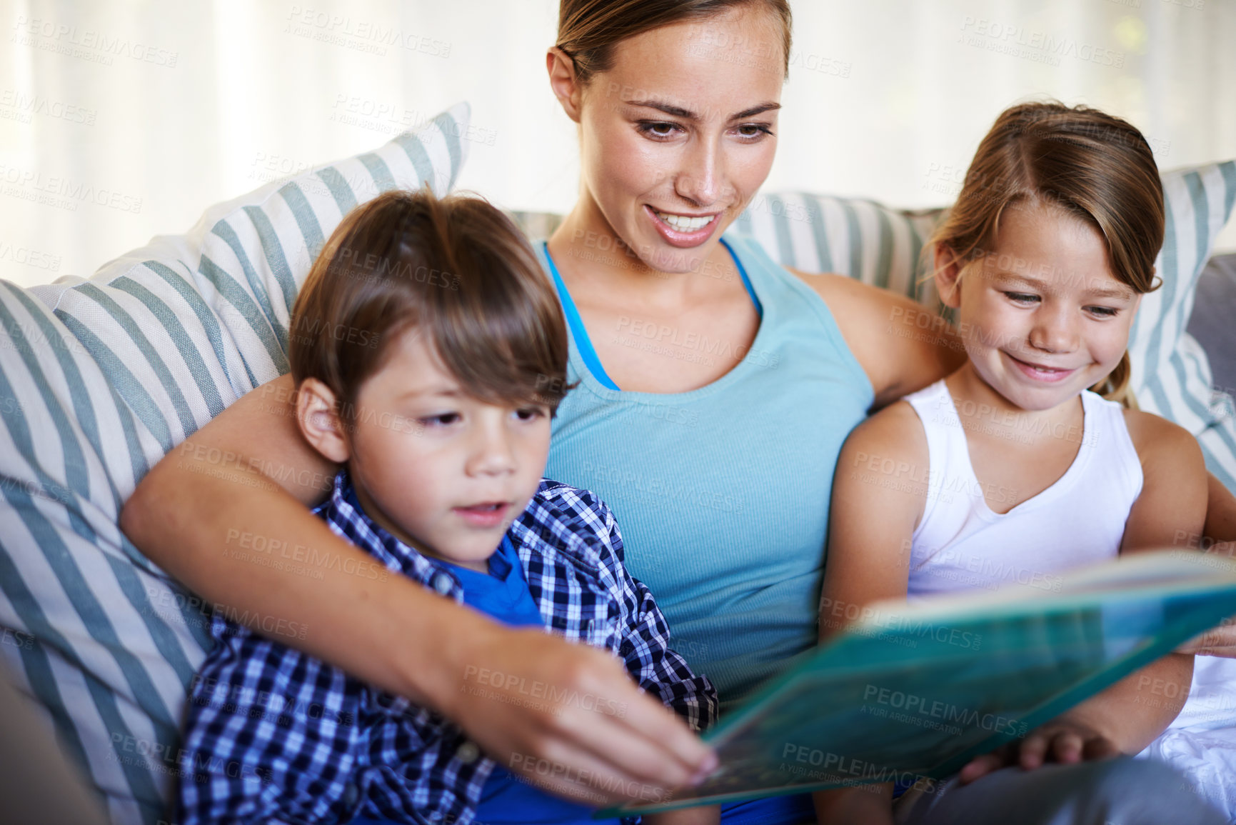 Buy stock photo Mother, children and reading on sofa with book for fantasy story and learning for english literature or language skills for development. Family, relax and happy on couch in home with love and bonding