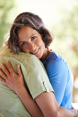 Buy stock photo Portrait, happy woman and man with hugging for love, outdoor and commitment in marriage with security. Face, smile and wife by husband on honeymoon, nature and embrace for bonding together on holiday