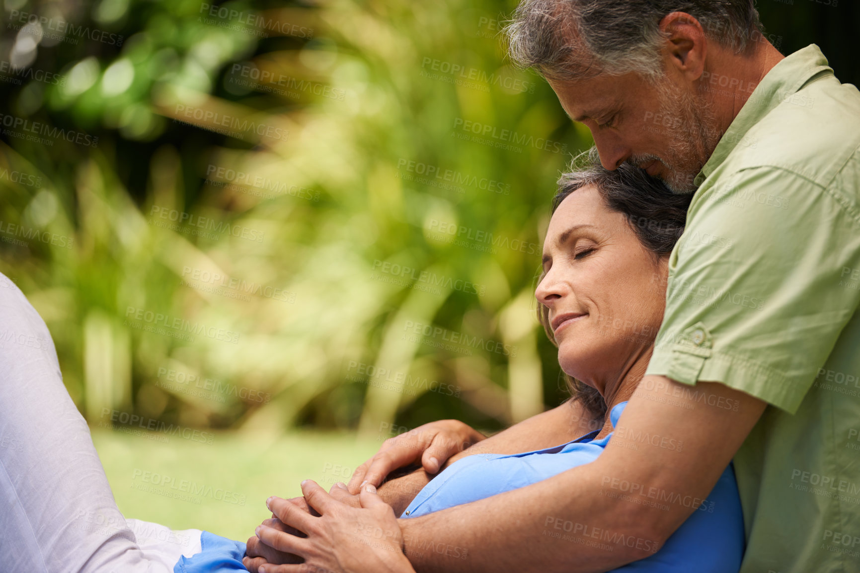 Buy stock photo Love, relax and mature couple in park with comfort, support or trust in marriage with bonding. Smile, embrace and woman with man in garden together for romantic gesture with care, kindness and nature