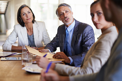 Buy stock photo Executive, senior or business people in meeting, discussion, conversation in boardroom with CEO. Teamwork, colleagues talking or mature employees planning strategy, feedback report or group project