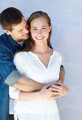 Buy stock photo Couple, hug and portrait with smile in studio for love with embrace, connection and support together. Man, confident and woman with romance or trust for bonding, security and spouse for comfort