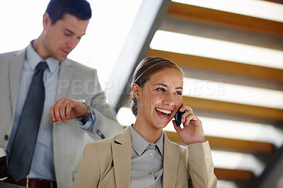 Buy stock photo Business, call and communication with management on progress of deal, negotiation or agreement. Man, woman and mobile phone talking to marketing assistant, executive or manager satisfied with result