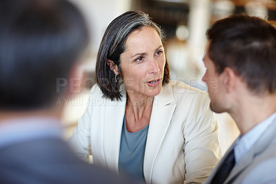 Buy stock photo Business people, discussion or meeting in office for corporate project or collaboration on work. Mature woman, young man and talking with mentor of franchise idea and entrepreneur of startup company