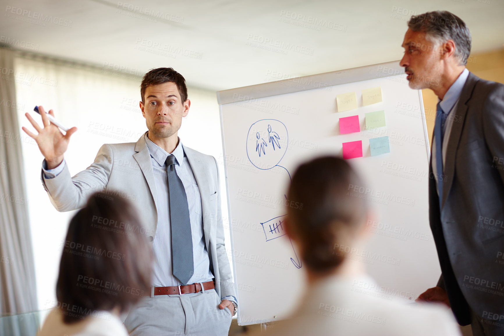 Buy stock photo Professional man, business and presentation of strategy for company in staff meeting with confidence, boardroom and manage team. Male person, workplace and communicate ideas with colleagues.