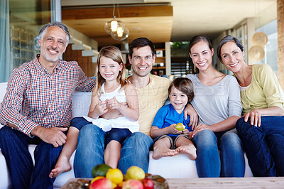 Buy stock photo Portrait, smile and big family on sofa in home for love, bonding and siblings relax together. Happy parents, grandparents and kids in a living room for connection with mother, father and children