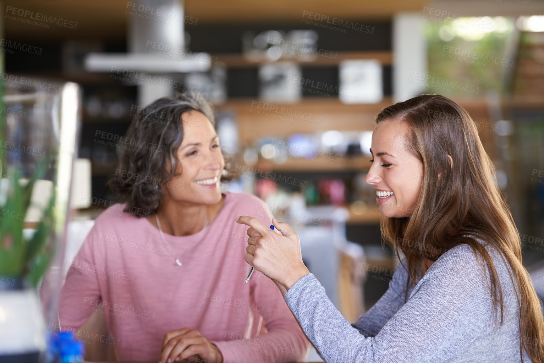 Buy stock photo A mother and daughter bonding in cafe