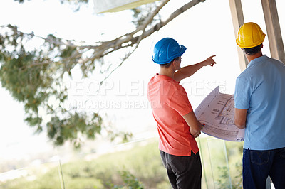 Buy stock photo Two architects assessing the structure they are building 