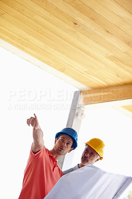 Buy stock photo Blueprint, construction and architect pointing with man on site for inspection, project management and planning. Professional contractor, engineer or developer with teamwork, solution and building