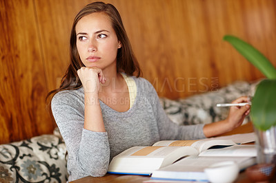 Buy stock photo Woman, thinking and home with textbook to study for university exams or test and reading notes. female person, college and student in living room or lounge for distance learning and revision.