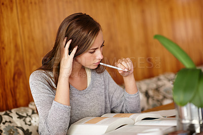 Buy stock photo Woman, thoughts and home with textbook to study for university exams or test and reading notes. Thinking, female person and happy as college student in living room for distance learning and revision 