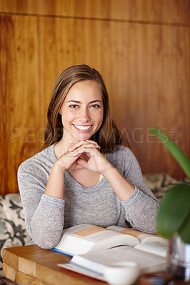 Buy stock photo Woman, smile and home with textbook to study for university exams or test and reading notes. Portrait, female person and happy as college student in living room for distance learning and revision 