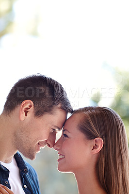 Buy stock photo Touch, couple and forehead in outdoors for love, marriage and romance or care in nature. People, hug and bonding or relax for pride in relationship or commitment, loyalty and connection on date
