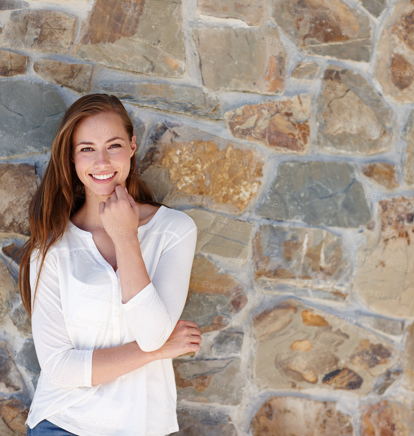 Buy stock photo A pretty young woman standing outside on a sunny day