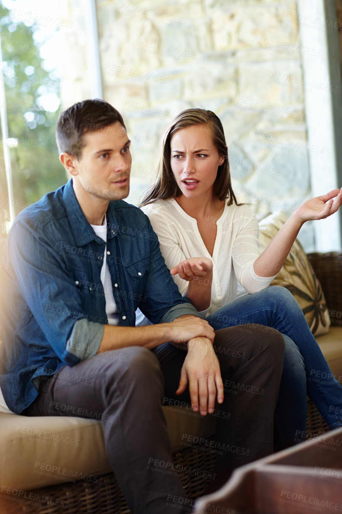 Buy stock photo Couple, argument and fight in home on sofa with stress or  angry and sad with disappointment. Relationship, confrontation and disappointed in living room on couch with conflict and emotions.