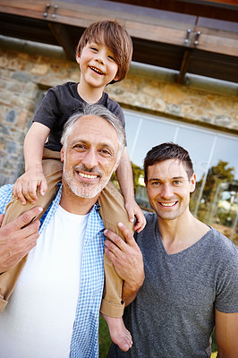 Buy stock photo Father, grandfather and child in portrait with generations at family house by embrace, bonding and love in garden. Grandpa, people and dad with kid on shoulders on vacation with nature for memory
