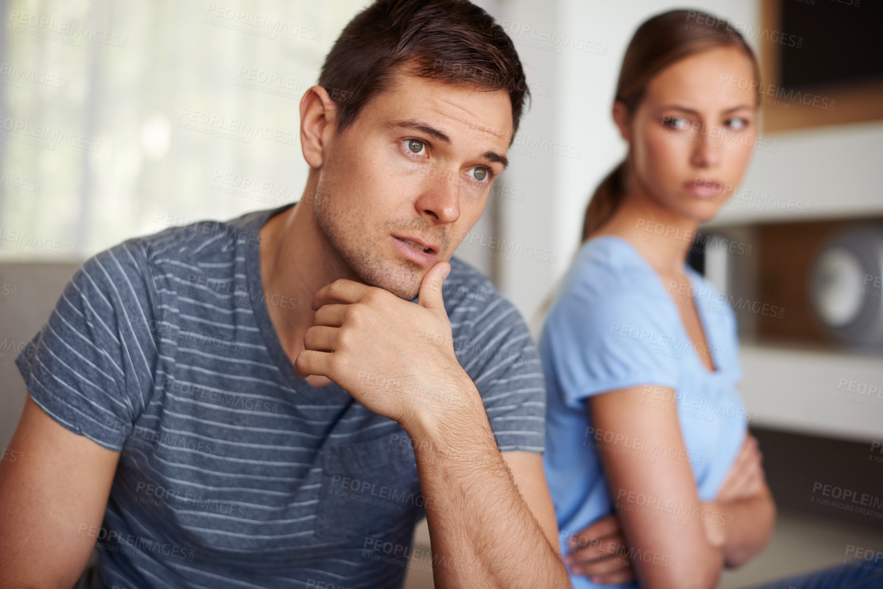 Buy stock photo Couple, disappointed and fight in home on sofa with stress or angry and sad with marriage issues. Relationship, confrontation and argument in living room on couch with conflict and emotional